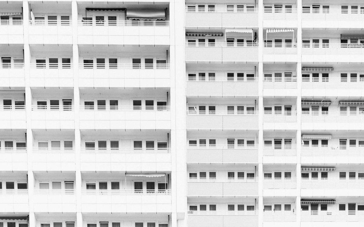 Repeating modular facade of a white concrete building